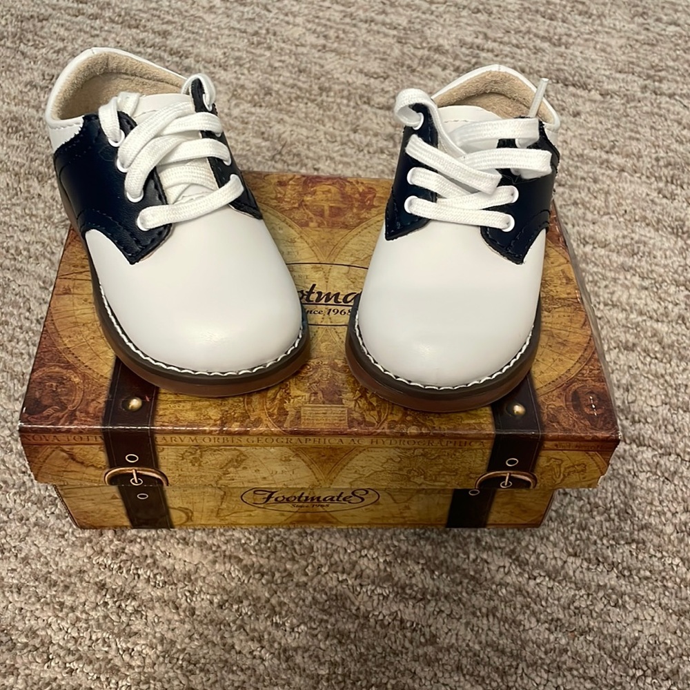 Blue and white baby walking shoes. Size 4